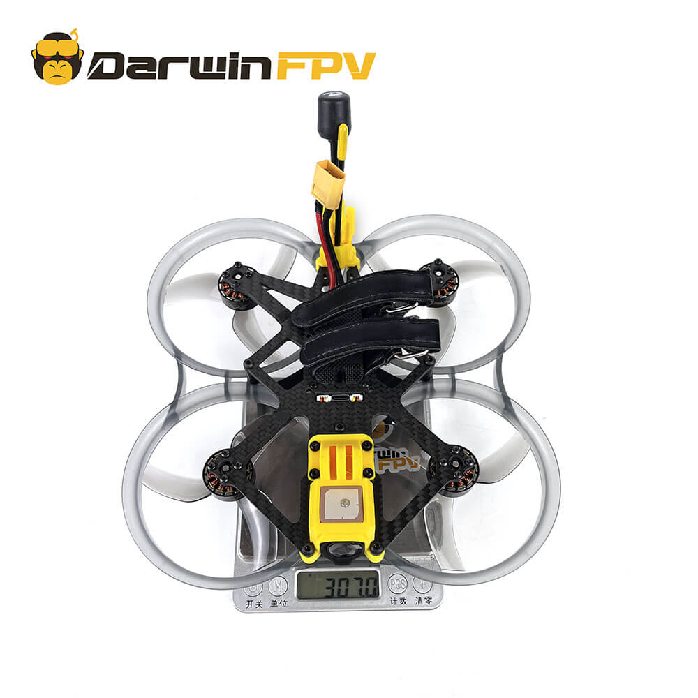 Top view of the DarwinFPV CineApe35 O3 drone showing its total weight of 307.0 grams on a scale