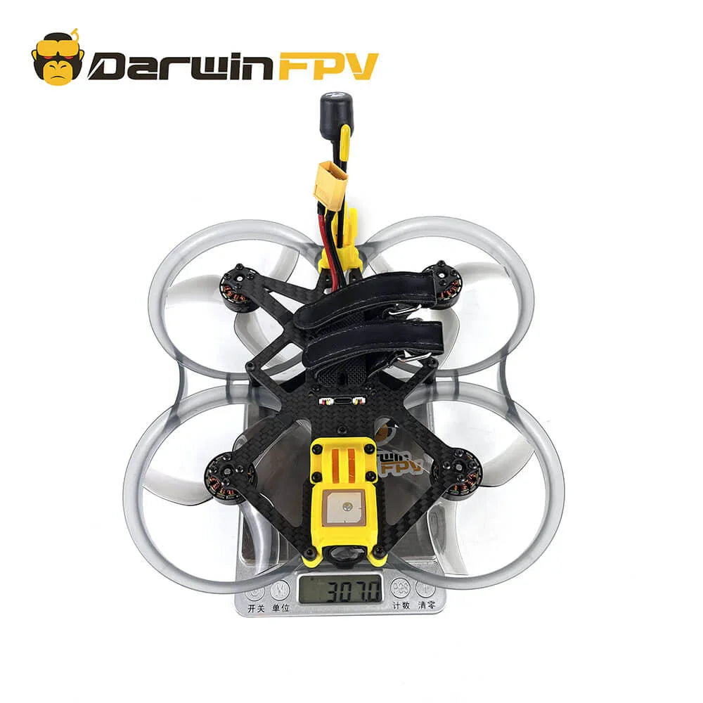 Top view of the DarwinFPV CineApe35 O3 drone showing its total weight of 307.0 grams on a scale