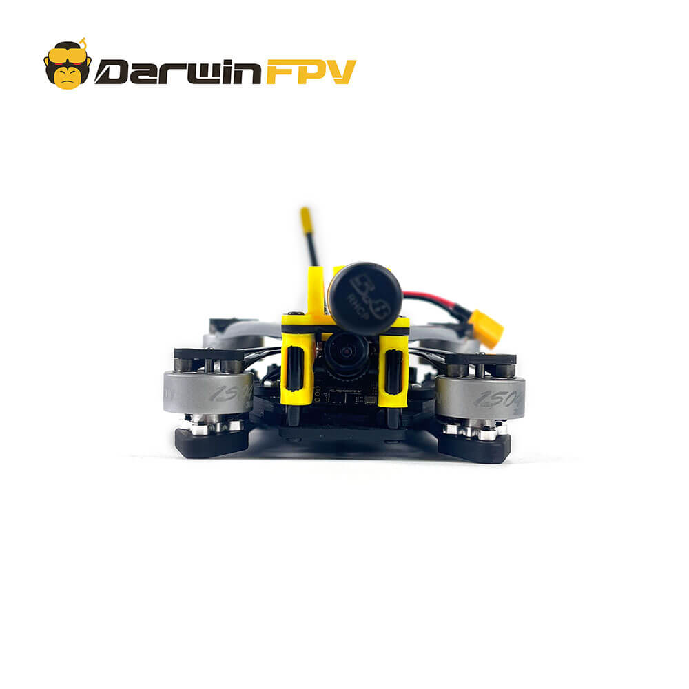 Front view of a DarwinFPV FPV drone showcasing its camera and motor setup, with yellow protective casing and a compact design