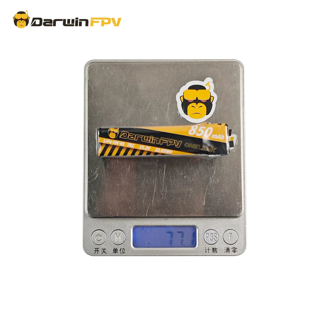 DarwinFPV ONELINK 4S 850mAh 70C Lipo-HV FPV drone battery (15.2V, 12.92Wh) placed on a digital scale, displaying a weight of 77 grams