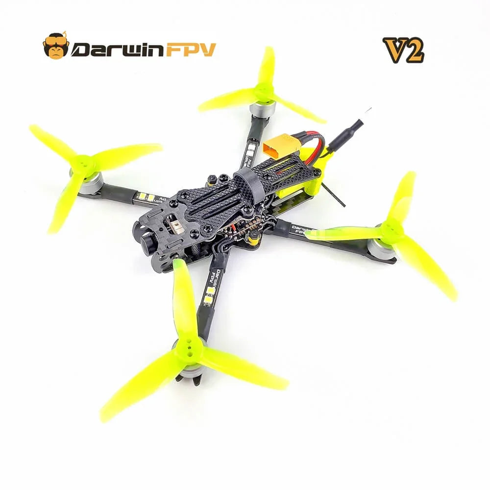 DarwinFPV BabyApe Pro V2 racing drone with bright yellow four-blade propellers and carbon fiber frame for high-performance first-person view flight