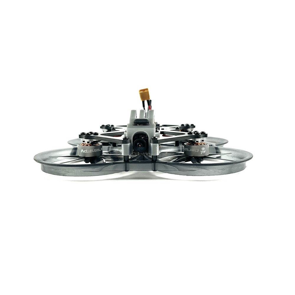 Front view of a high-performance FPV drone with a sleek, aerodynamic design, showcasing its camera and ducted propellers for enhanced stability and control.