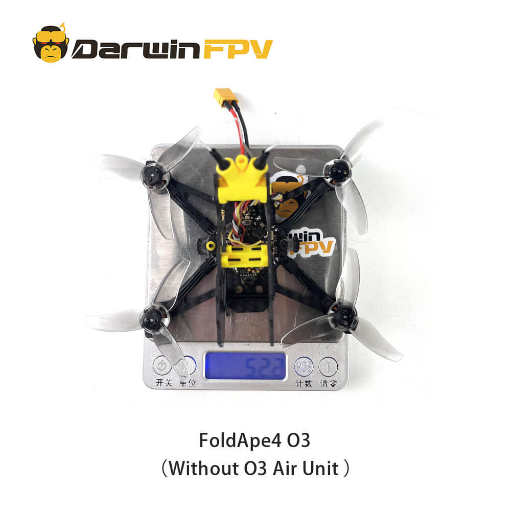 Top view of the DarwinFPV FoldApe4 O3 without O3 version drone, showing the weight on a digital scale reading 52.2 grams. The drone is equipped with a yellow module and four propellers