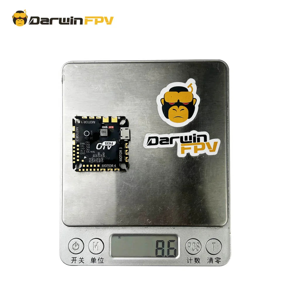 The DarwinFPV F435 AIO is being weighed on a digital scale with the brand's logo visible
