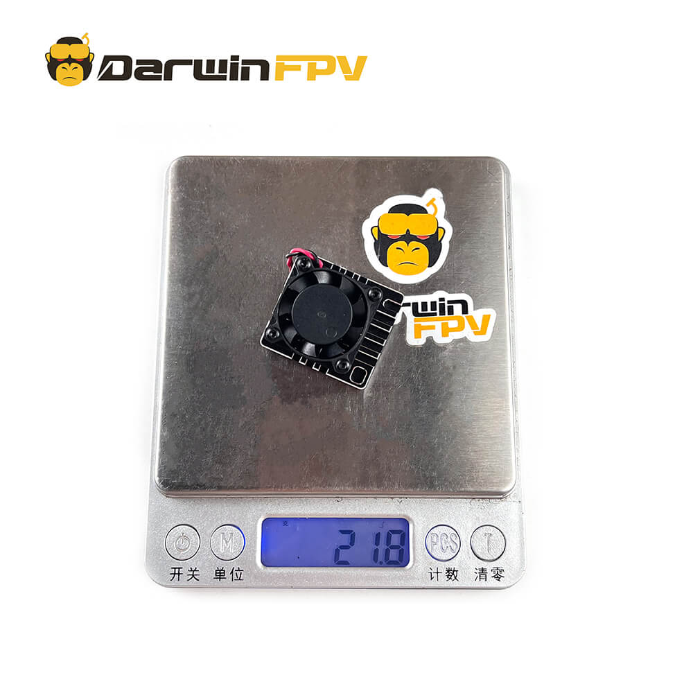 DarwinFPV Cement 5.8G 2.5W Waterproof VTX weighing 21.8 grams on a digital scale, showcasing its lightweight and durable build