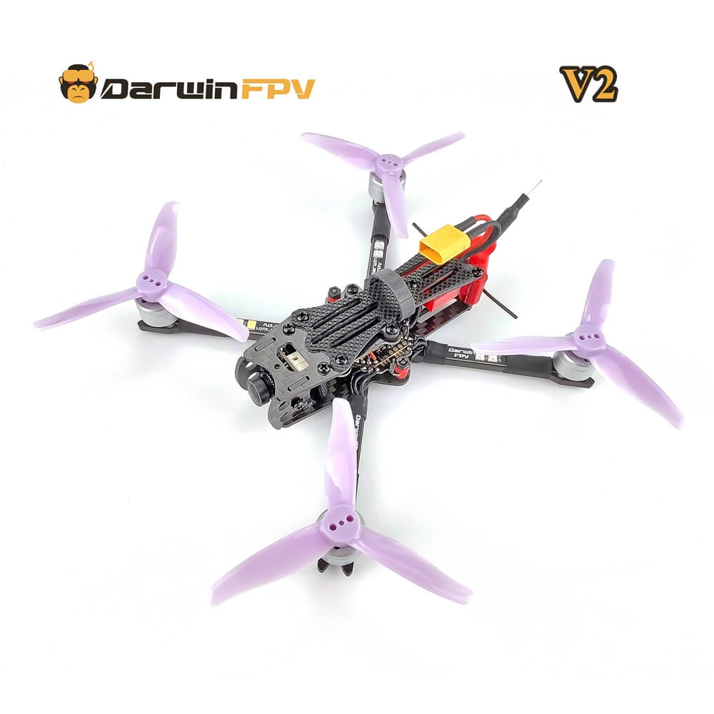 DarwinFPV V2 freestyle fpv drone, equipped with purple four-blade propellers and carbon fiber frame, designed for high-performance first-person perspective flight