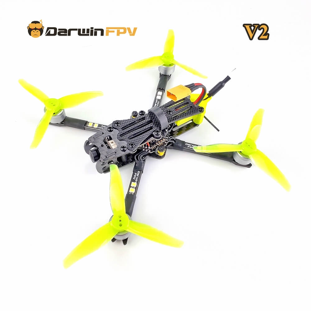 DarwinFPV BabyApe Pro V2 racing drone with bright yellow four-blade propellers and carbon fiber frame for high-performance first-person view flight