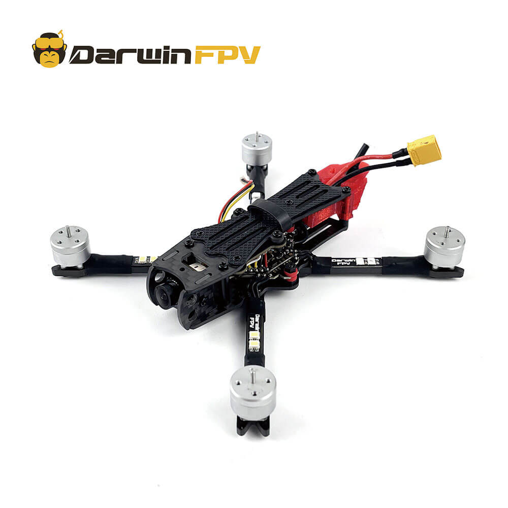 DarwinFPV high-performance FPV drone frame equipped with four motors and a battery connector, featuring a durable carbon fiber design, ideal for competitive racing drones