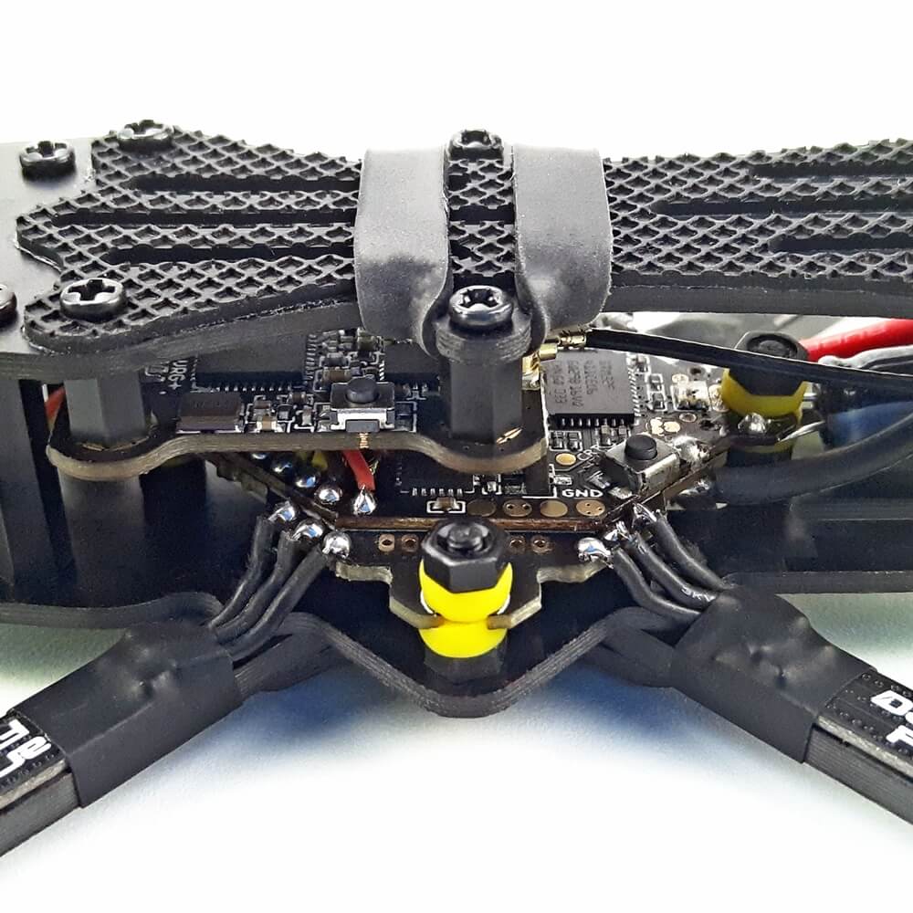 A detail of the DarwinFPV BabyApe drone’s electrical setup, showing the flight control board, ESC, and precision wiring, optimized for FPV flight.